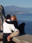 Couple oblivious to giant monkey (Gibraltar)